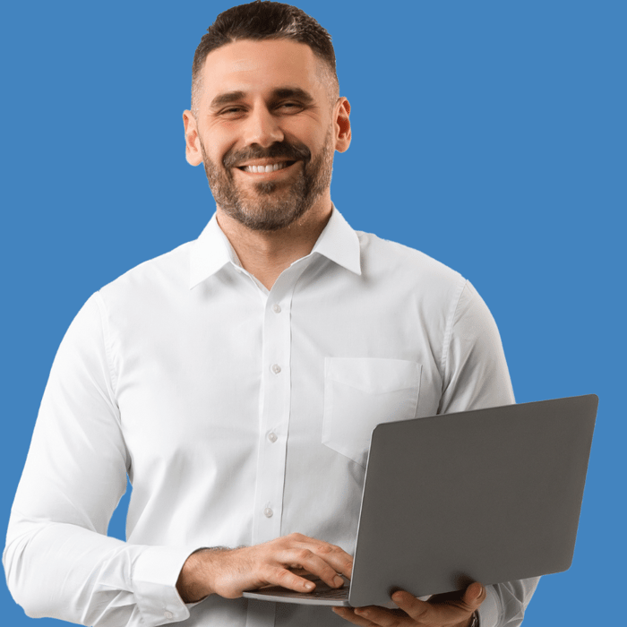 Man holding laptop and smiling 
